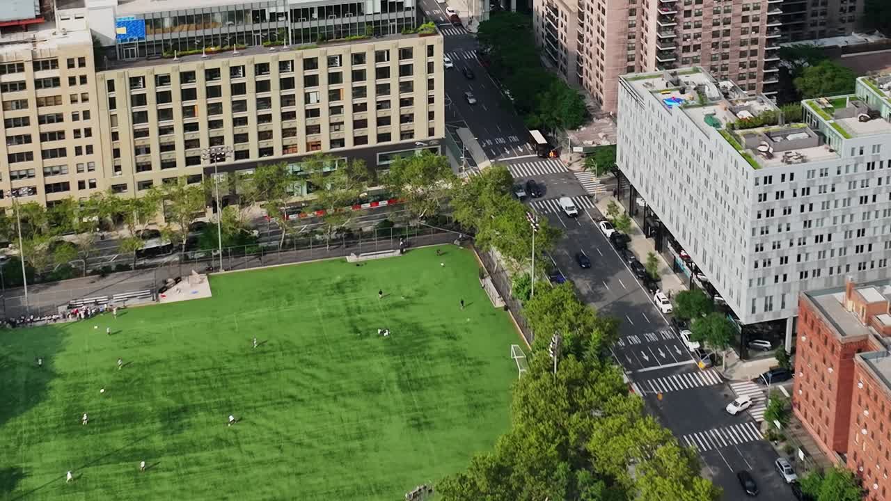 Aerial view of soccer field and urban streets in New York City