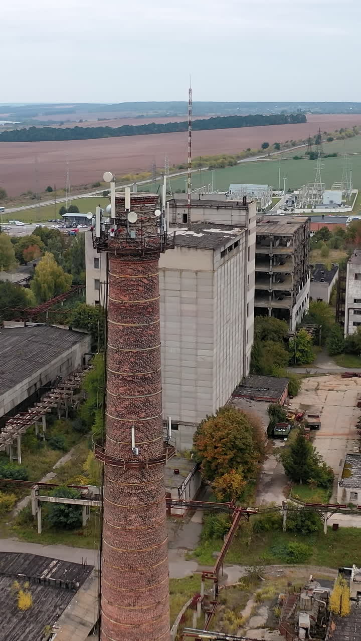 Factory abandoned destroyed territory. Old destroyed industrial building. Vertical video