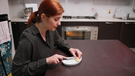 woman eats a small typical calabrese pastry