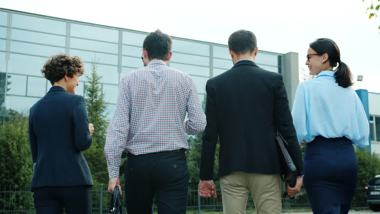Business Team Walking Outside Office Building
