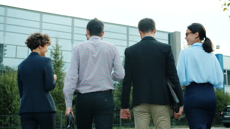 Business Team Walking Outside Office Building