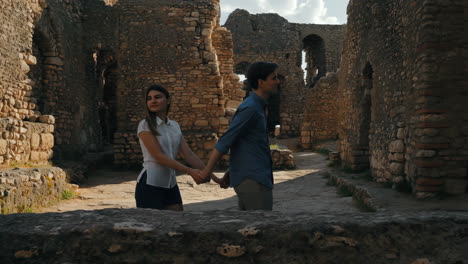 couple exploring ancient ruins
