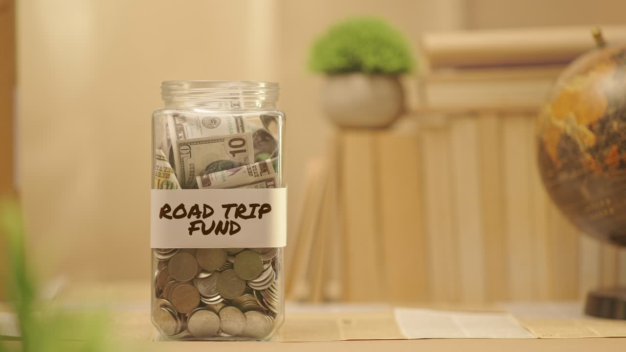 PERSON SAVING MONEY FOR ROAD TRIP FUND