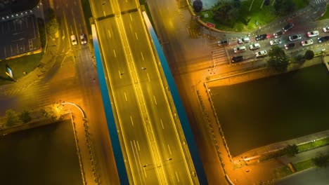 aerial hyperlapse of traffic at night in city highways