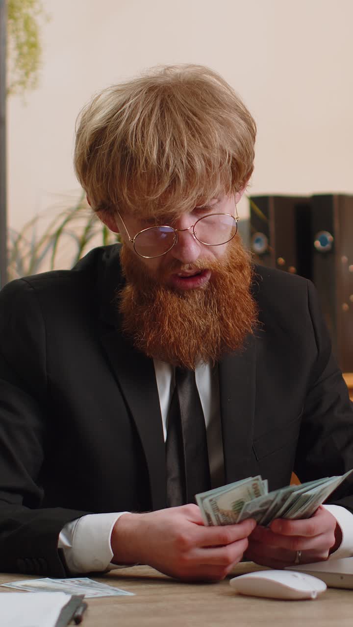 Rich businessman in suit working on laptop pc counting money cash calculate earnings income profit