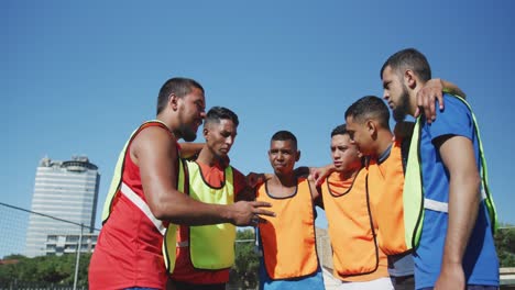 Soccer-players-planning-strategy-on-the-field