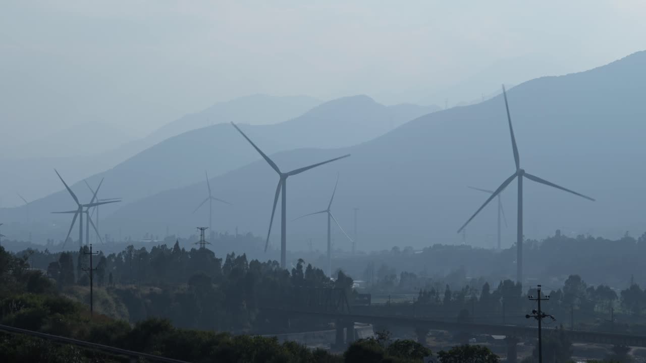 A large Chinese windfarm located in the valley of Sichuan located in between traditional chinese farms