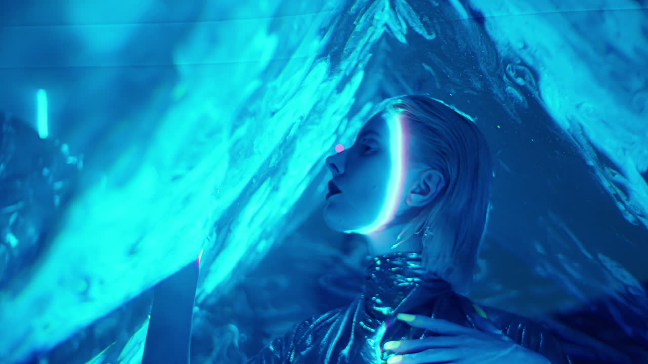 Attractive Alien Woman Posing in Blue Laser Light