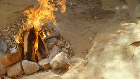 campfire burning in countryside 4k