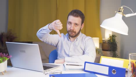 home office worker man making negative gesture at camera.