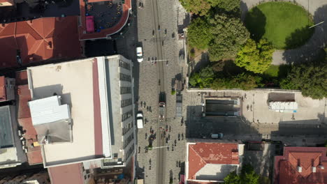 Taksim-Tram-and-Subway-entry-on-famous-shopping-street-in-Istanbul-with-people,-Aerial-Birds-Eye-Overhead-Top-down-view