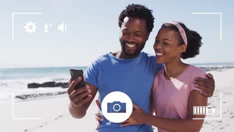 Animation-of-frame-over-african-american-couple-using-smartphone