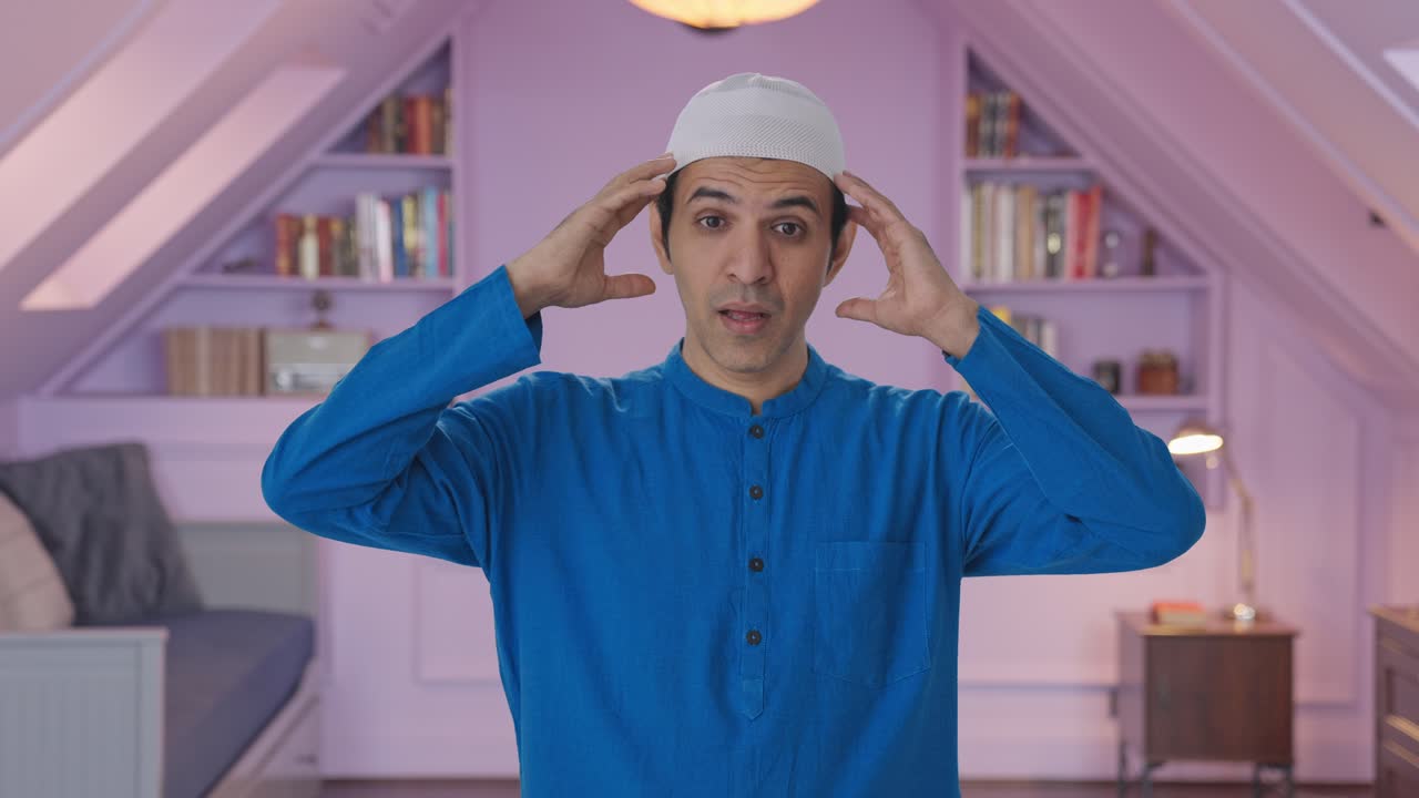 두통을 고 있는 무슬림 병자