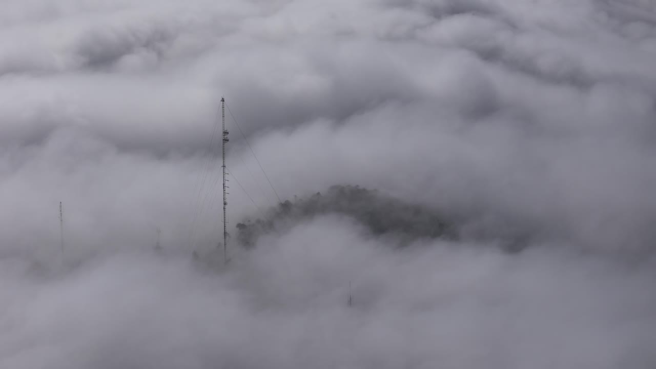 Antennas in the middle of the rolling clouds on the mountains of Porto