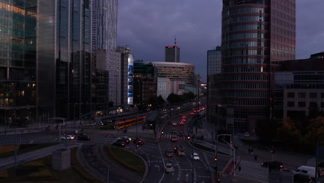 Landing-footage-of-heavy-traffic-in-city-centre-during-evening-rush-hour.-Busy-multilane-street-and-road-intersection.-Warsaw,-Poland