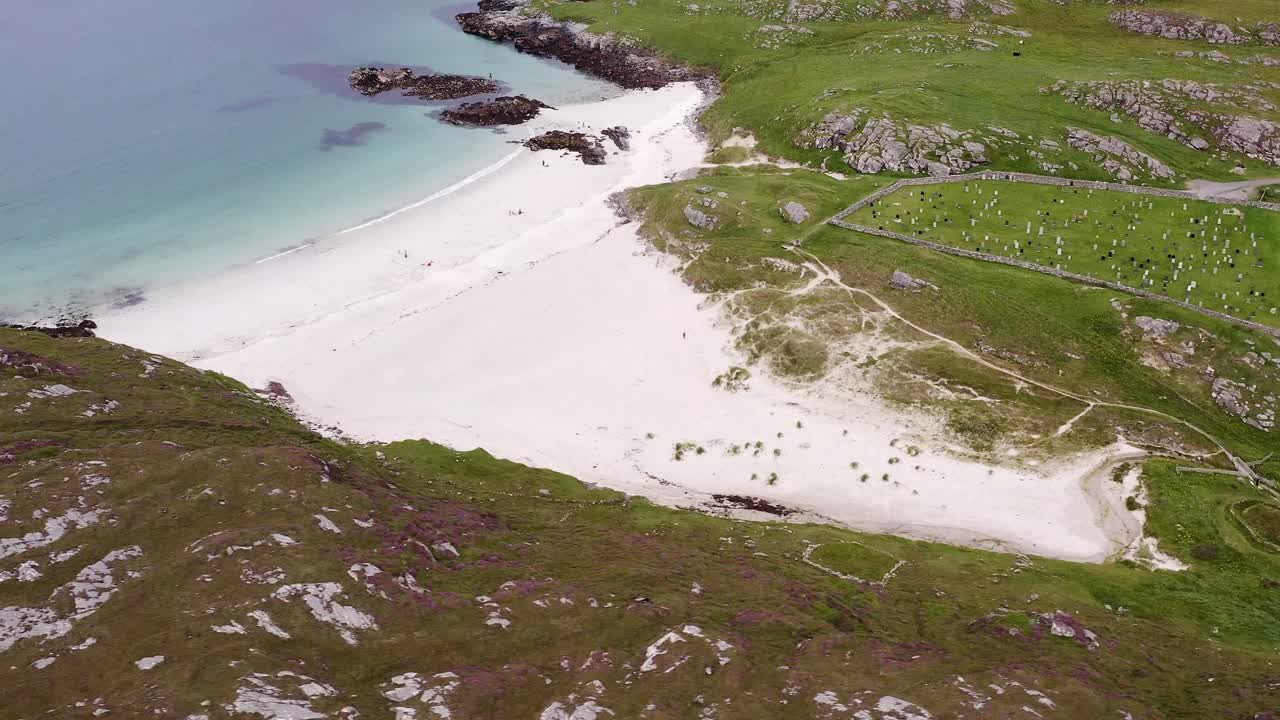 Drone shot of the cemetery and Iron Age House at Bosta beach on the Isle of Great Bernera, near the Isle of Lewis on the Outer Hebrides of Scotland