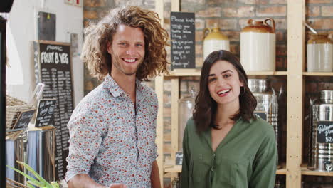 Portrait-Of-Couple-Shopping-In-Sustainable-Plastic-Free-Grocery-Store