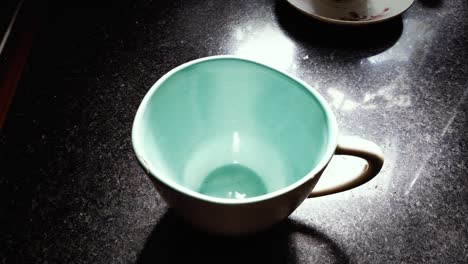 rice fall in bowl on table, close-up.