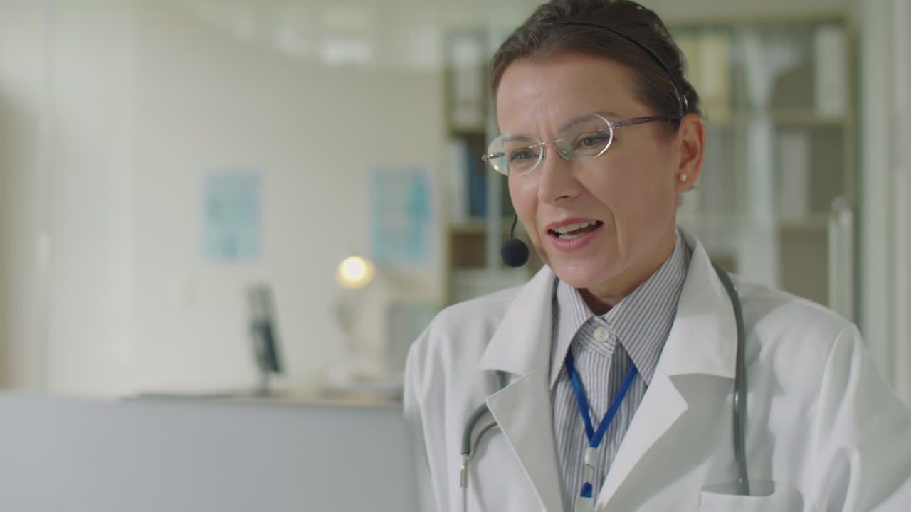 Female Doctor Speaking on Video Call with Patient