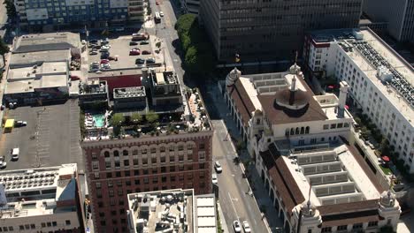 flying over tall building rooftops in los angeles