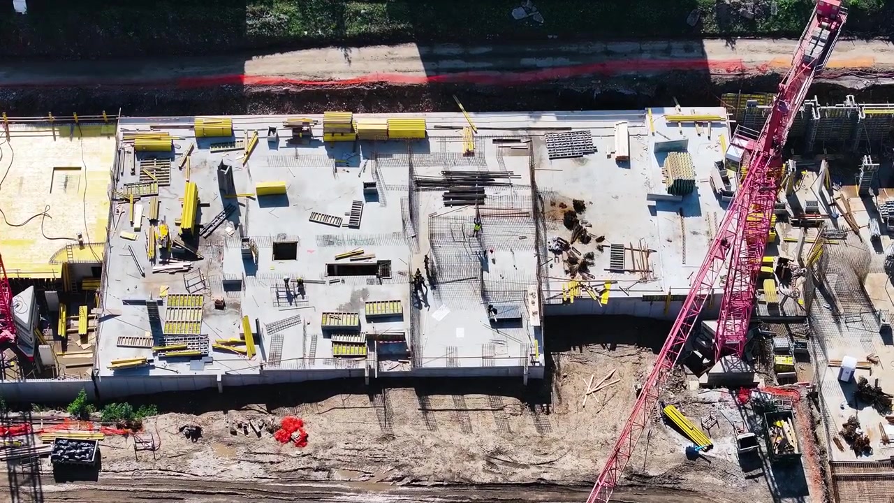 Building construction site from above, foundation concrete layer on ground
