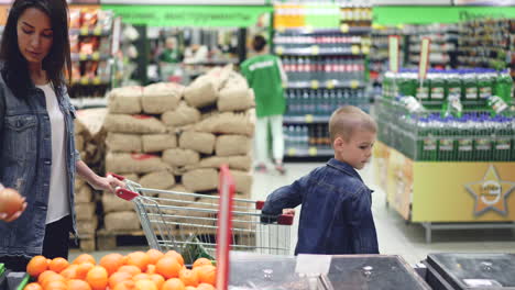 mother and son shopping at the supermarket