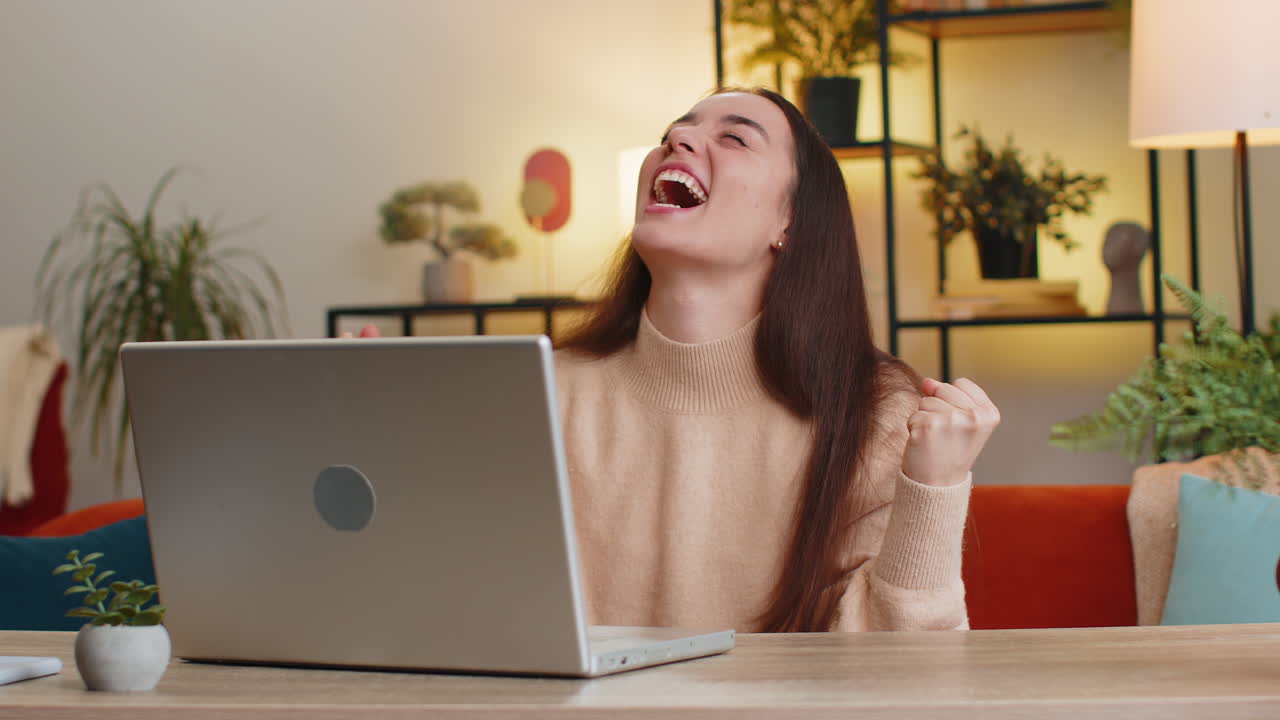 Amazed shocked caucasian woman use laptop computer receive good news message victory celebrate win
