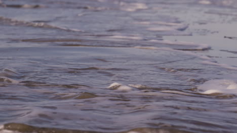 Sea-waves-rushing-at-the-beach-during-sunset