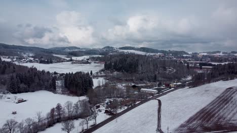 snowy rural landscape of czechia with beautiful clouds, flying forward
