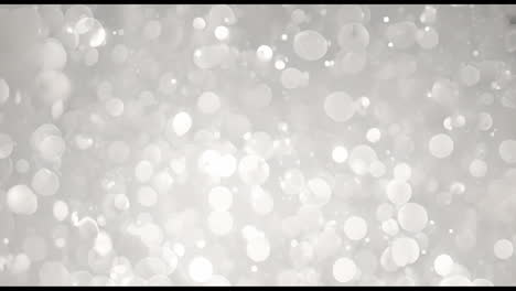 animation of white spots moving on gray background