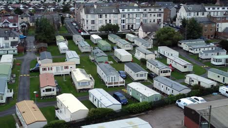 static caravan trailer beachfront staycation holiday home campground resort aerial view zoom out