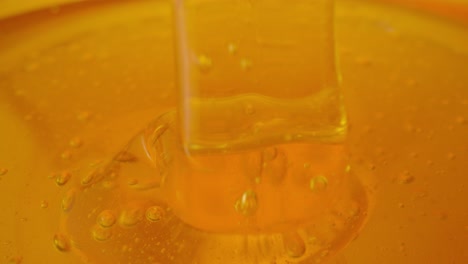 close-up of honey with bubbles