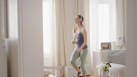 funny-woman-dancing-at-home-wearing-headphones-listening-to-music-celebrating-with-funky-dance-moves-enjoying-freedom-having-fun-on-weekend-4k