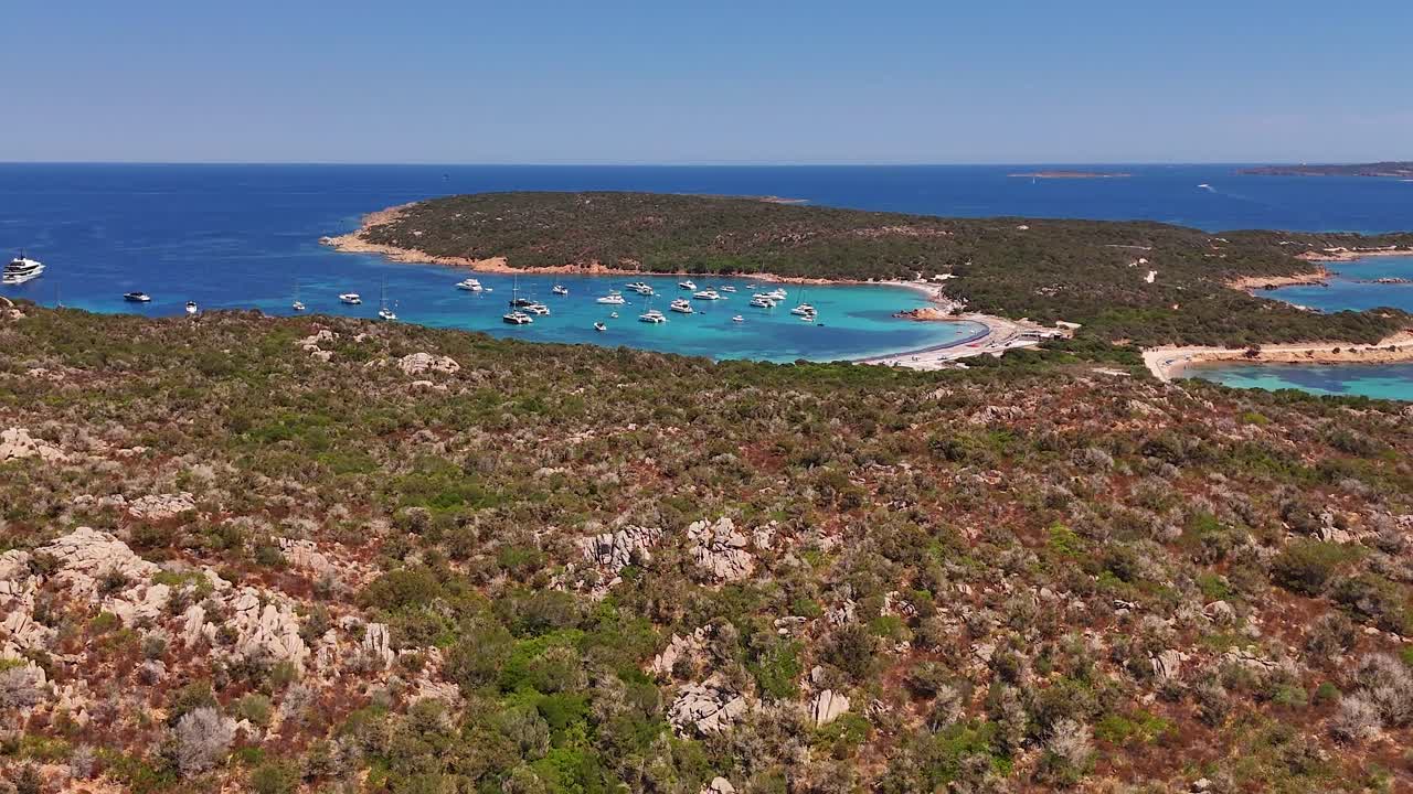 Serene Sardinia lagoon view with anchored yachts in a sunny landscape