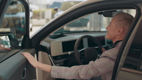 woman experiencing new electric car