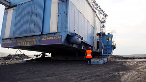 large excavator maintenance or transport at mining site