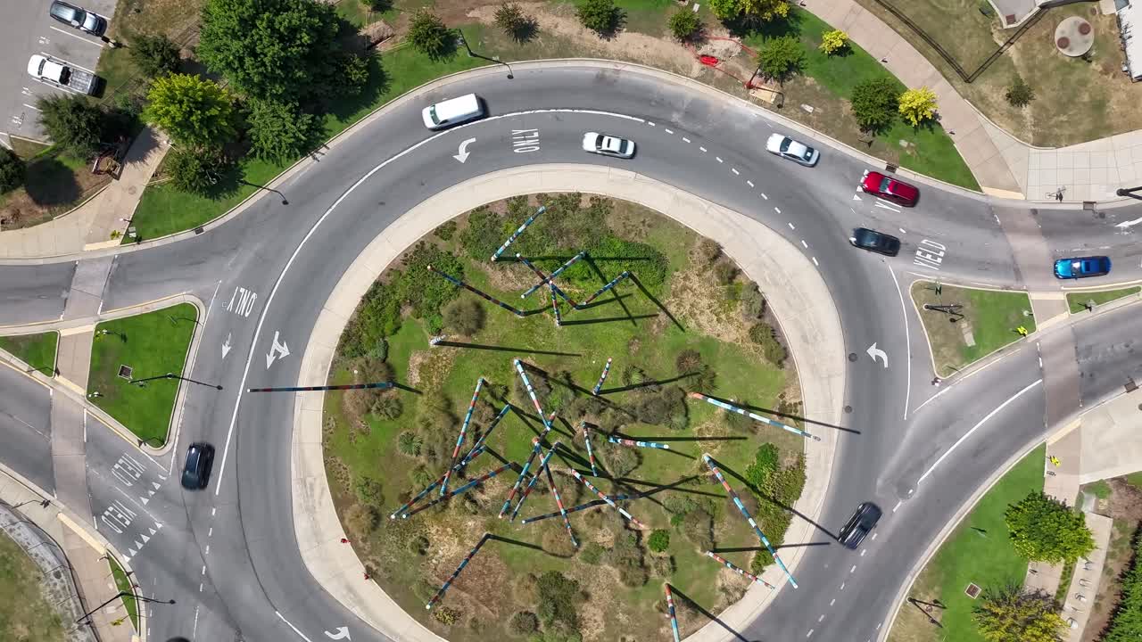 Aerial View of a Roundabout with Modern Art Installation