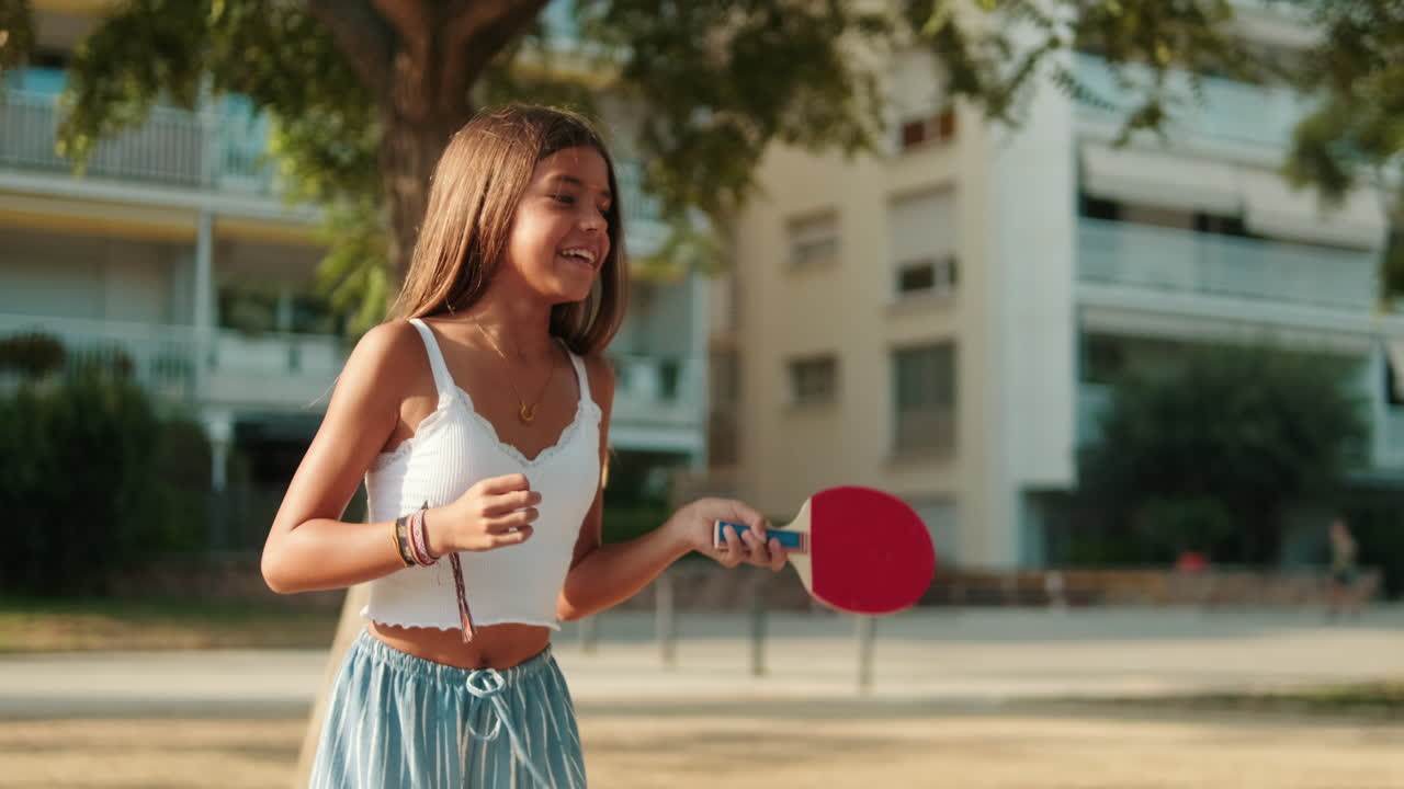 Woman playing table tennis in the park