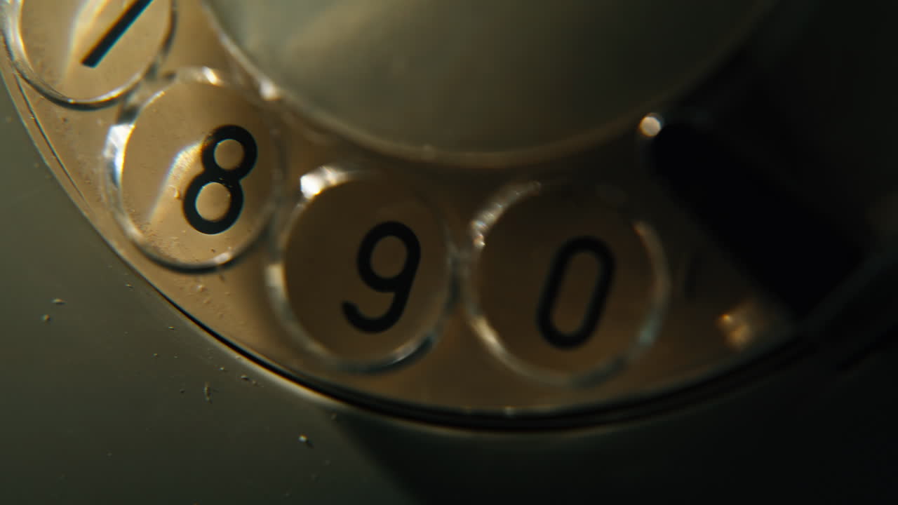 Mechanical phone dial closeup. Rotary circular mechanism of retro telephone stay