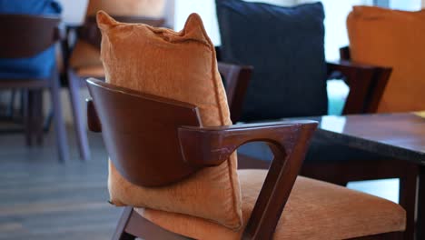 cafe chairs with orange cushions