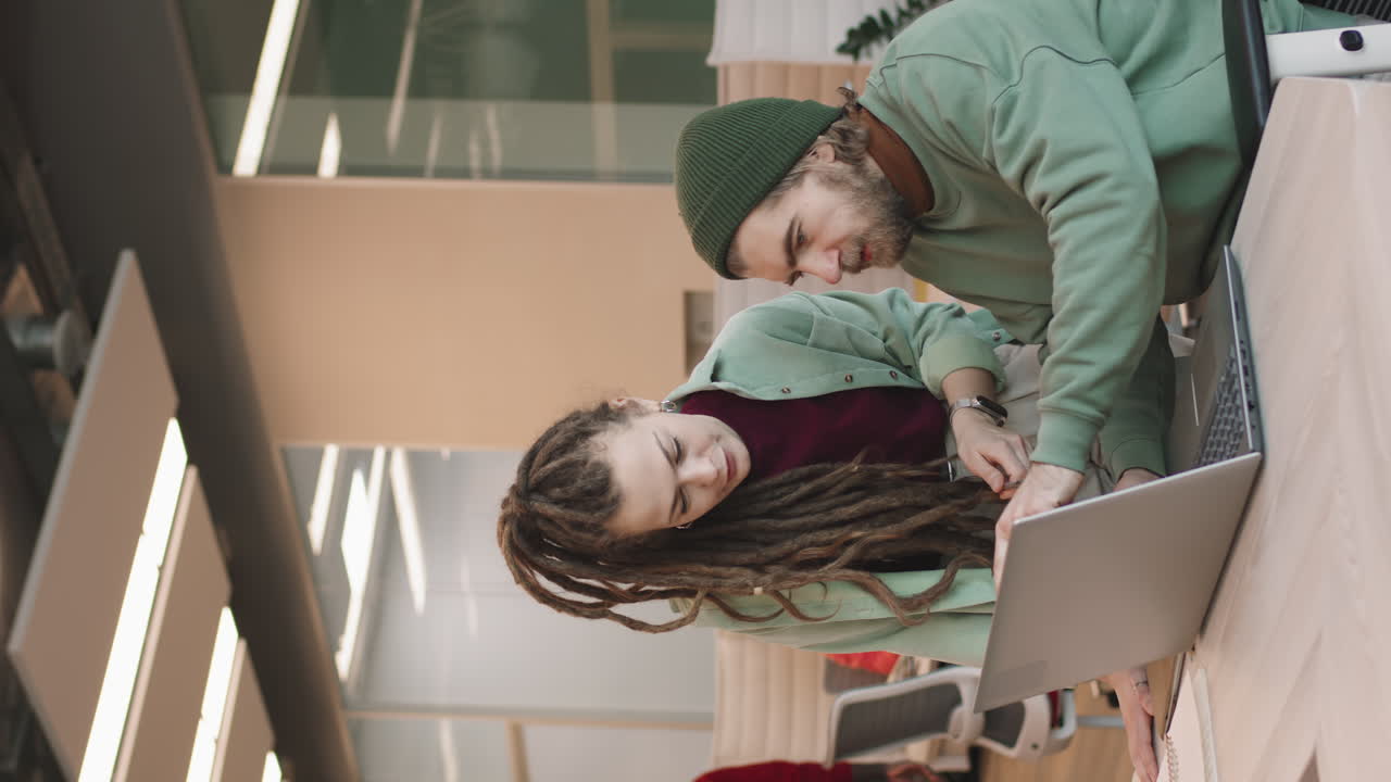 Vertical Shot of Businesspeople Discussing Project