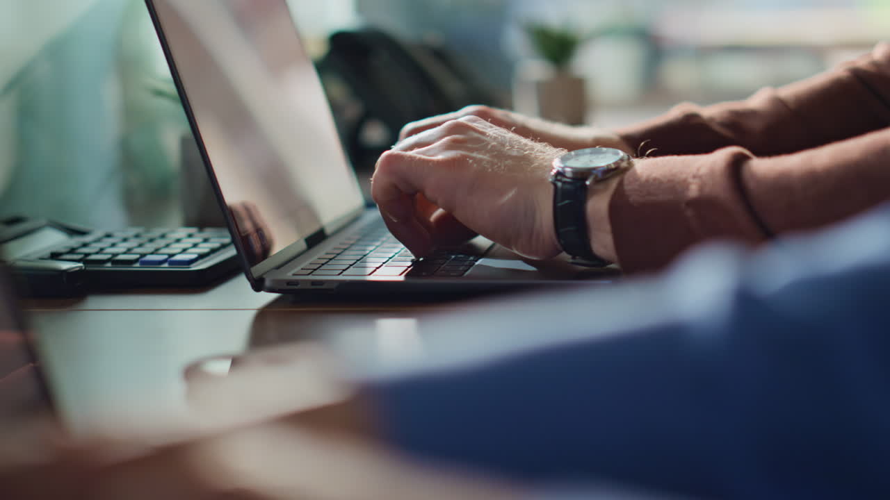 Two professionals hands typing on laptops at office closeup. Unknown managers
