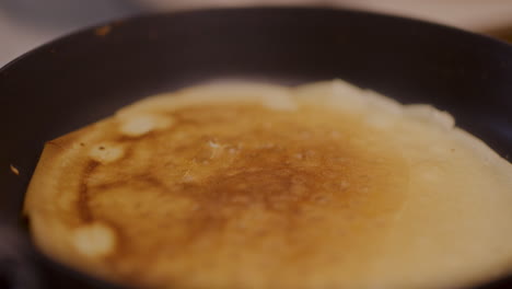 close-up of pancake frying in pan