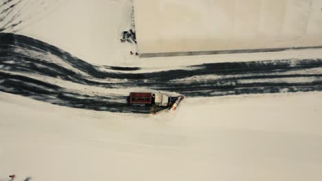 Aerial-View-Of-A-Truck-With-Snow-Plow-Clearing-Snow-On-The-Street-In-Toronto,-Canada-In-Winter