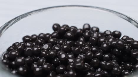 black caviar in glass bowl