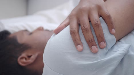 man sleeping peacefully in bed
