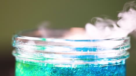 colorful liquid with rising bubbles and vapor