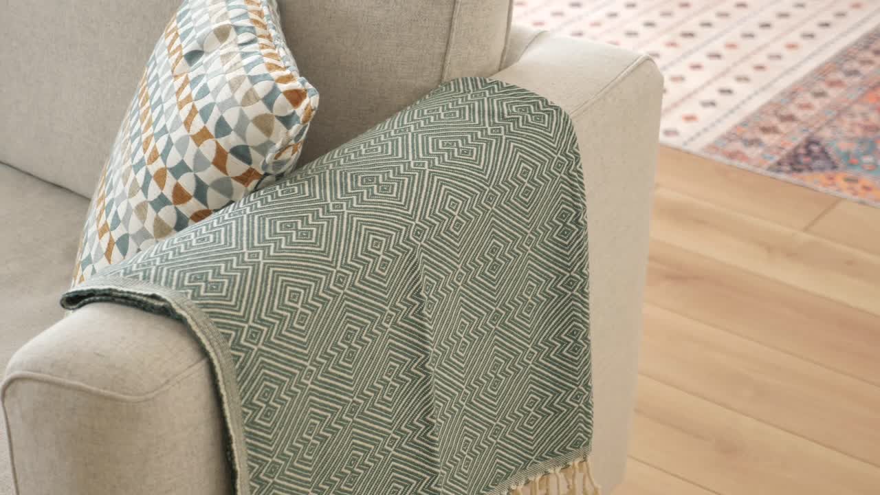 Cozy Sofa with Throw Blanket and Pillows