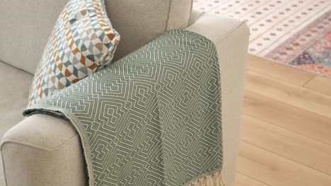 cozy sofa with throw blanket and pillows