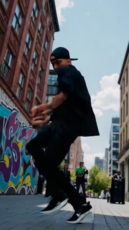 dynamic street dance performance in an urban setting with graffiti